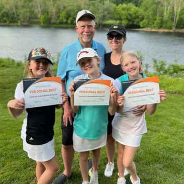 A family together on the course celebrating their Op 36 personal bests