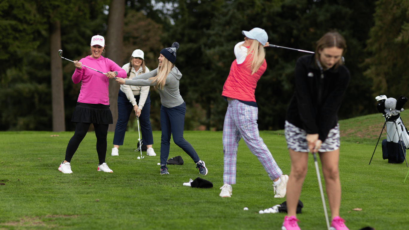 Families learning golf together