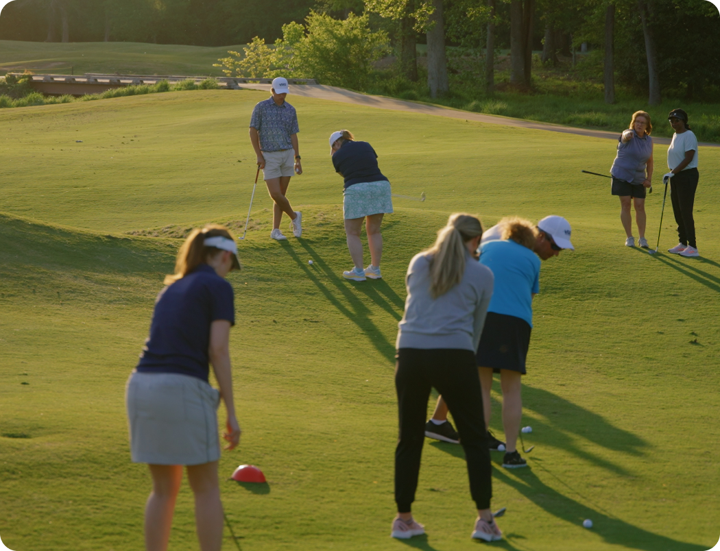 A group of adult golfers practicing together in a weekly class