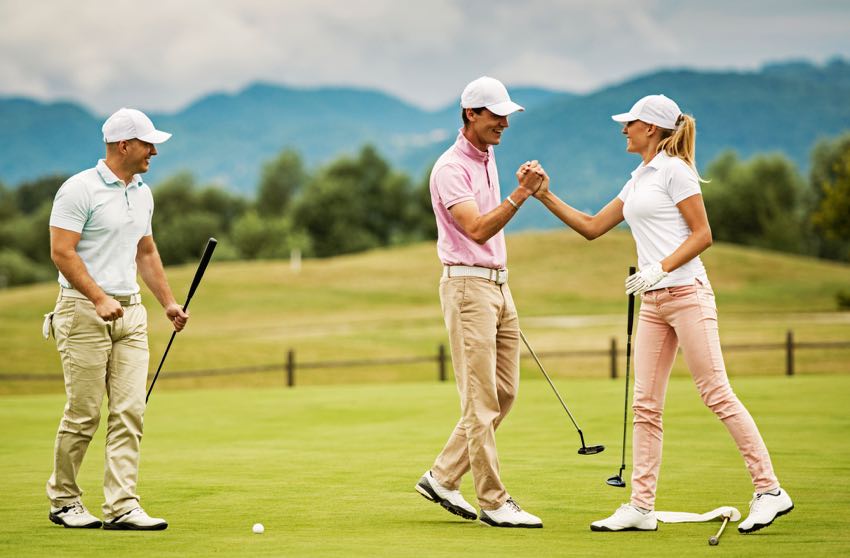 Group of young adults playing golf