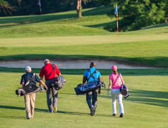 Group of adults playing golf
