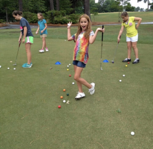 Junior Golfer Practicing Putting